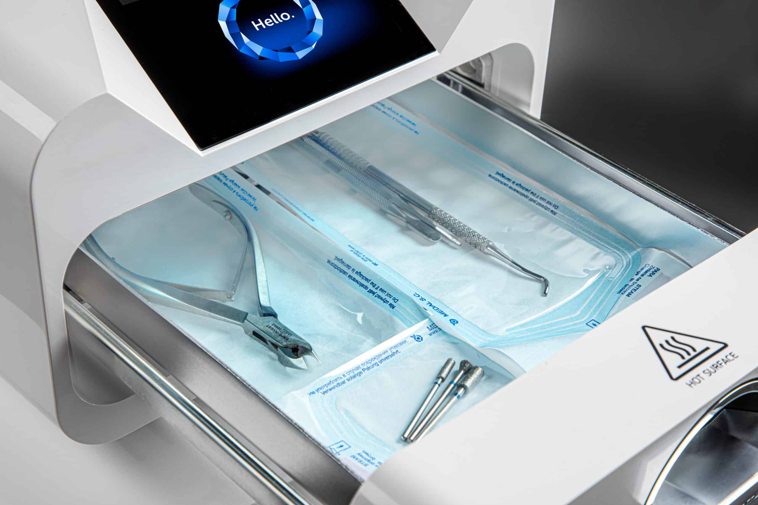 Enbio PRO autoclave with packaged instruments in the sterilisation chamber