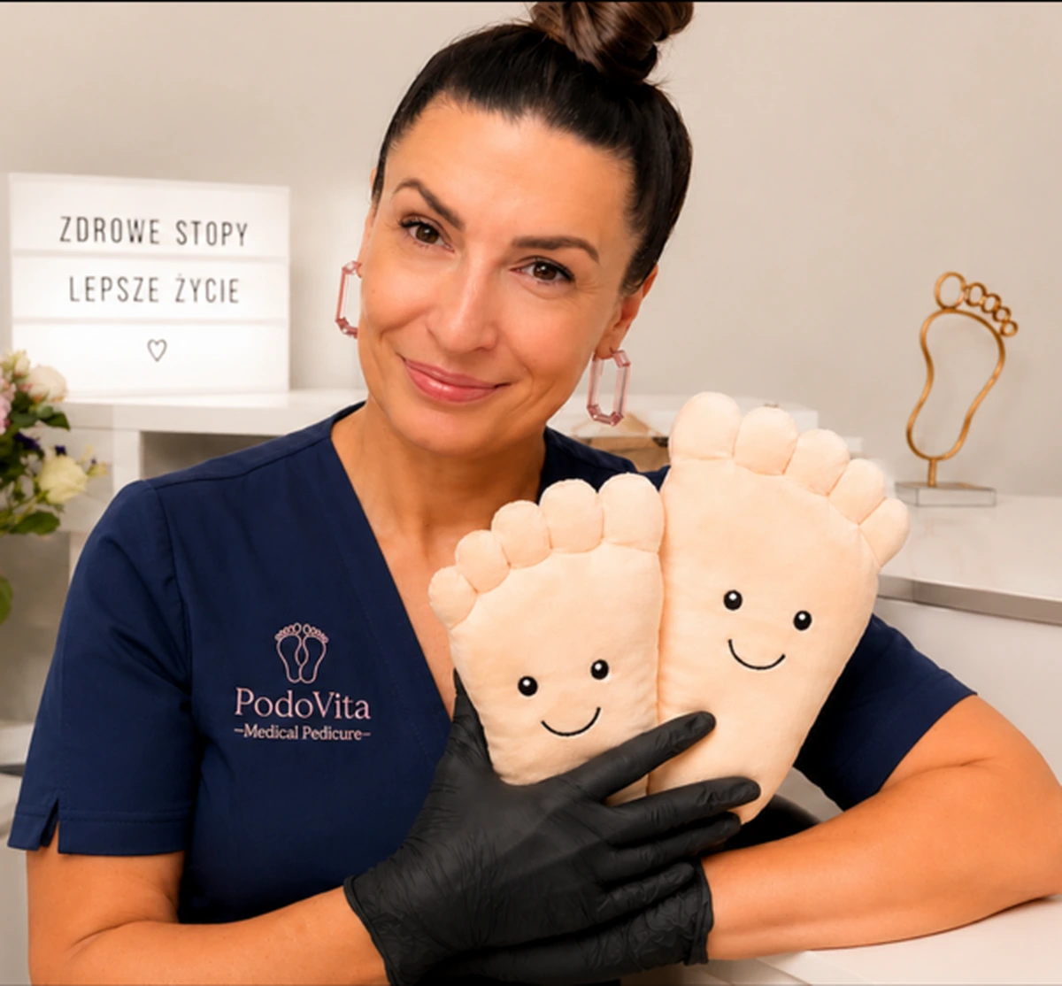 PodoVita foot health practitioner with foot care models